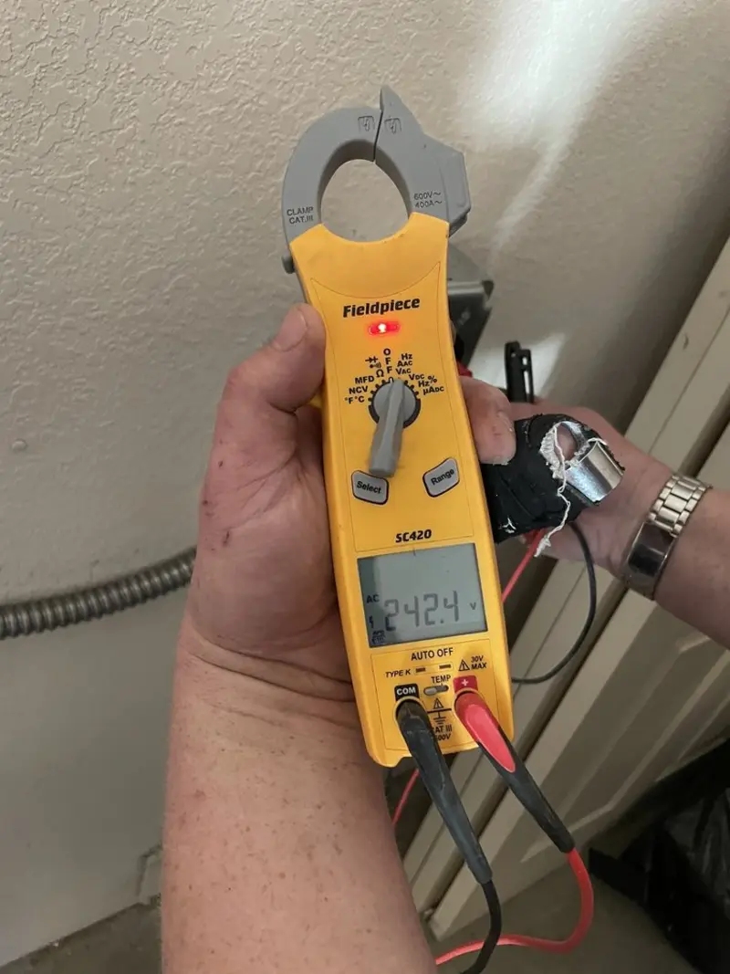 Voltage testing with clamp meter during Electrical Installation Services in Grand Haven